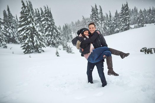 Were out on another adventure. a happy young couple enjoying themselves while being out in the snow