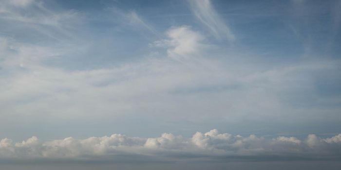 Atmosphere panorama real photo beauty nature wallpaper. Fantastic sky view clouds cumulus cirrus stratus line. Wallpaper design background like painted fairy tale mood. White pale blue tone.