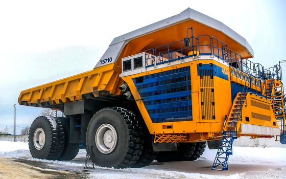 The plant houses heavy mining dump trucks. Plant for the production of heavy mining dump trucks, car assembly workshop.