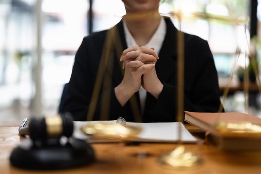 confident thoughtful businesswoman wearing suit sitting at work desk, pensive employee executive touching chin, solving problems, making difficult decision, pondering project strategy.