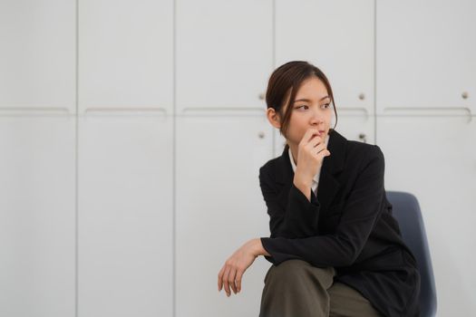 Portrait of smiling confident aisan female in office