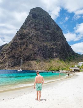 young men in a swim short on vacation in Saint Lucia, luxury holiday Saint Lucia Caribbean, men on vacation at the tropical Island of Saint Lucia Caribbean. Calabash beach St Lucia Caribbean
