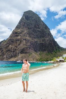 young men in a swim short on vacation in Saint Lucia, luxury holiday Saint Lucia Caribbean, men on vacation at the tropical Island of Saint Lucia Caribbean. Calabash beach St Lucia Caribbean