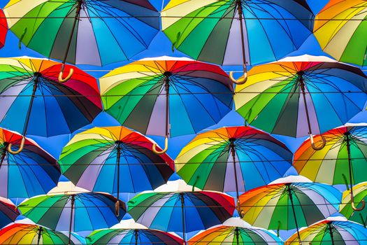 Colorful umbrellas Blue, green, red, rainbow umbrellas background Street with umbrellasin the sky