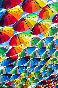 Colorful umbrellas Blue, green, red, rainbow umbrellas background Street with umbrellasin the sky