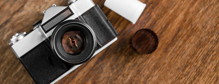 Vintage camera on wooden background