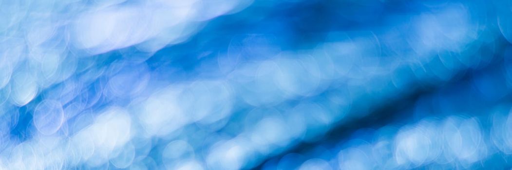 Blue abstract background with bokeh defocused lights