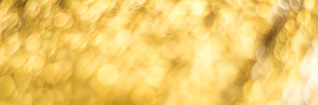 Gold abstract background with bokeh defocused lights