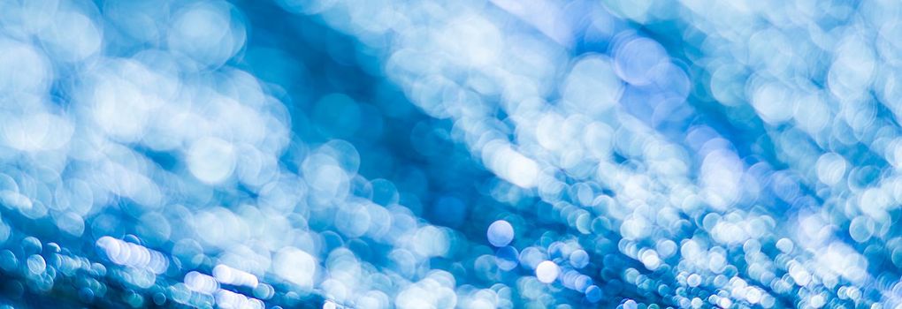 Blue abstract background with bokeh defocused lights