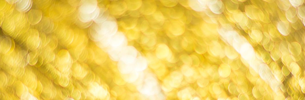 Gold abstract background with bokeh defocused lights