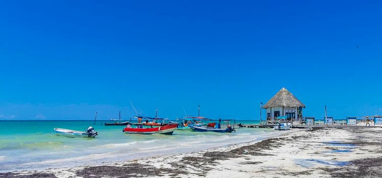 Holbox Mexico 16. May 2022 Panorama landscape view on beautiful Holbox island sandbank and beach with waves turquoise water and blue sky in Quintana Roo Mexico.