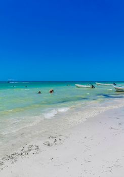 Holbox Mexico 16. May 2022 Panorama landscape view on beautiful Holbox island sandbank and beach with waves turquoise water and blue sky in Quintana Roo Mexico.