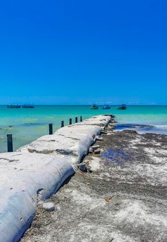 Panorama landscape view on beautiful Holbox island sandbank and beach with waves turquoise water and blue sky in Quintana Roo Mexico.