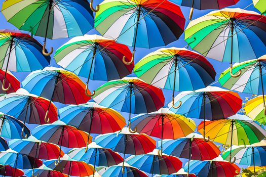 Colorful umbrellas Blue, green, red, rainbow umbrellas background Street with umbrellasin the sky