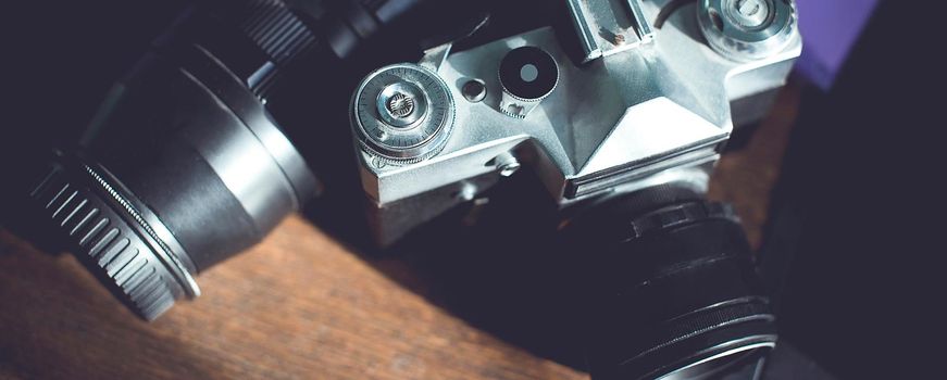 Vintage camera on wooden background