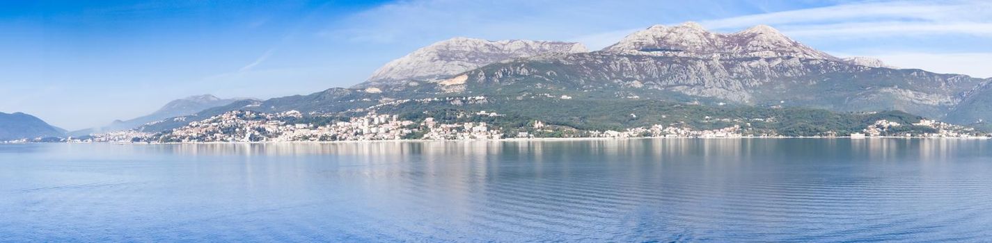 Panoramic view of Bay of Kotor from the sea surrounded by mountains in Montenegro, one of the most beautiful bay in the world.