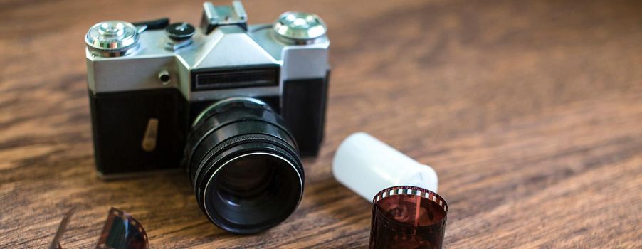 Vintage camera on wooden background