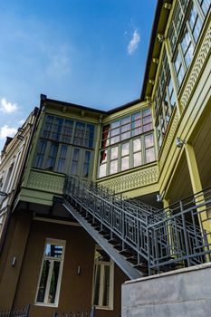 Traditional inner yard with carving wooden baclonies in Kala area in Tbilisi, capital city of Georgia