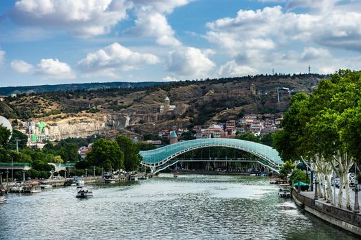 Famous view to Peace Bridge and Narikala castle in georgian capital city of Georgia, Tbilisi