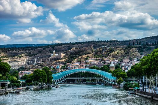 Famous view to Peace Bridge and Narikala castle in georgian capital city of Georgia, Tbilisi