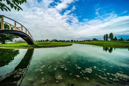 Pond with reflection in golf grassland