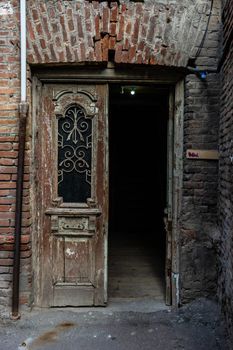 Old door with carving details in buildings of Old town of Tbilisi, Georgia