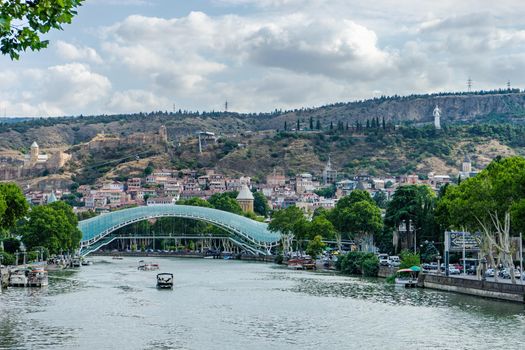 Famous view to Peace Bridge and Narikala castle in georgian capital city of Georgia, Tbilisi