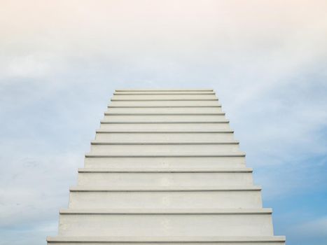 A white staircase stretches up the horizon. That means to be success or go to heaven.