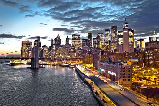 Skyline of New York City downtown and Brooklyn bridge dusk view, United States of America