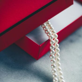wonderful pearls in a red gift box, luxe present - jewellery and luxury gift for her styled concept