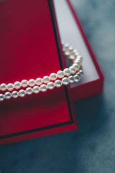 wonderful pearls in a red gift box, luxe present - jewellery and luxury gift for her styled concept