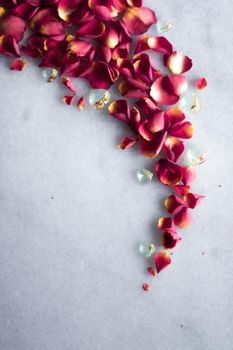 rose petals on marble flatlay - wedding, holiday and floral background styled concept