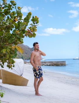 young men in a swim short on vacation in Saint Lucia, luxury holiday Saint Lucia Caribbean, men on vacation at the tropical Island of Saint Lucia Caribbean. sugar beach St Lucia Caribbean