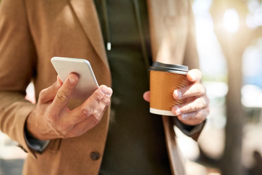 Communication is key even during his commute. an unrecognizable man sending a text message during his morning commute