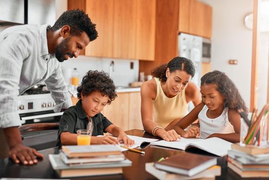 Play an active role in your childs homework. parents helping their two children with their homework
