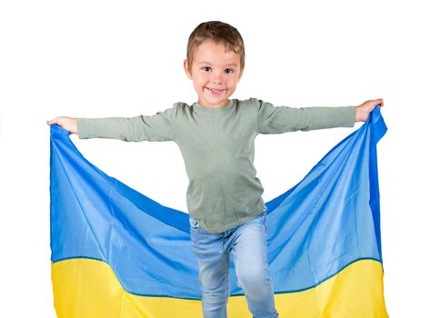boy with a soccer ball and the flag of Ukraine on a white background
