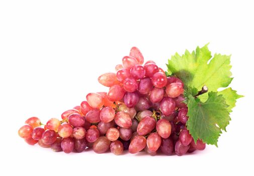 Ripe red grape with leaves isolated on white