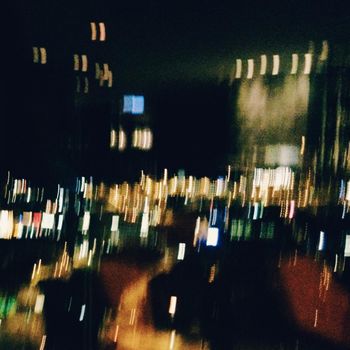 blurred city lights at night - dark abstract backdrop styled concept, elegant visuals