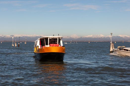 View of the typical vaporetto boat in the Grand Canal in Venice. The vaporetto is a Venetian public waterbus