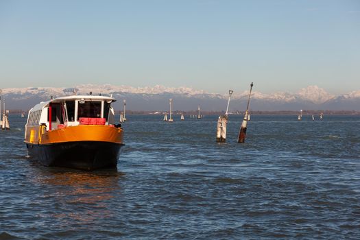 View of the typical vaporetto boat in the Grand Canal in Venice. The vaporetto is a Venetian public waterbus