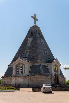 RUSSIA, CRIMEA - JUL 09, 2022: Sevastopol nicholas wonderworker cemetery crimea church russia monument cross pyramid, concept religion memorial from st from cathedral day, tower culture. Historical landscape sky,