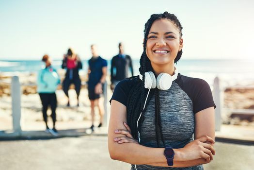 The change to a healthier lifestyle has been so rewarding. Portrait of a sporty young woman standing on the promenade