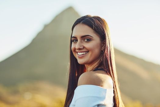 Travel so far you meet yourself. a beautiful young woman in nature