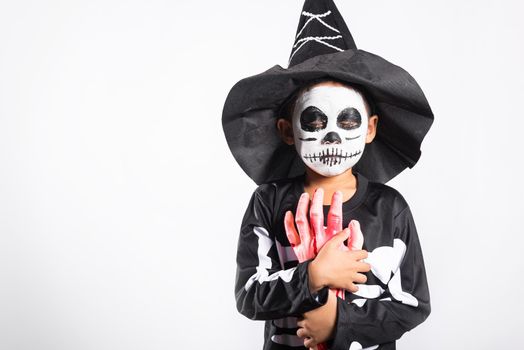 Halloween Kid. Child man horror face painting make up for ghost scary, Portrait of Asian little kid boy wearing skeleton costume studio shot isolated white background, Happy halloween day concept