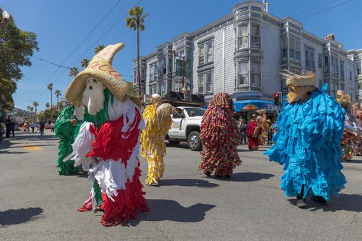 The outfits worn by the men are called tiliches. Made with pieces of colorful fabric, these costumes date back to the 19th century when people celebrated the expulsion of French invaders from the Oaxacan coast. The garments are prepared about one year before the carnival and the whole family participates in the production.