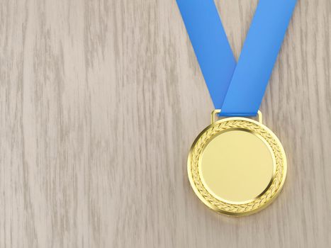 Gold medal on the wooden desk, top view