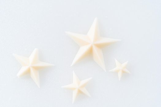 White chocolate stars in a silicone mold.