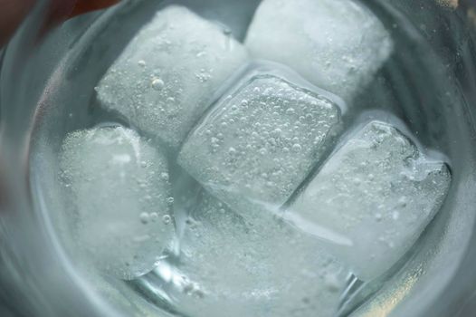 Ice in the water glass detail.