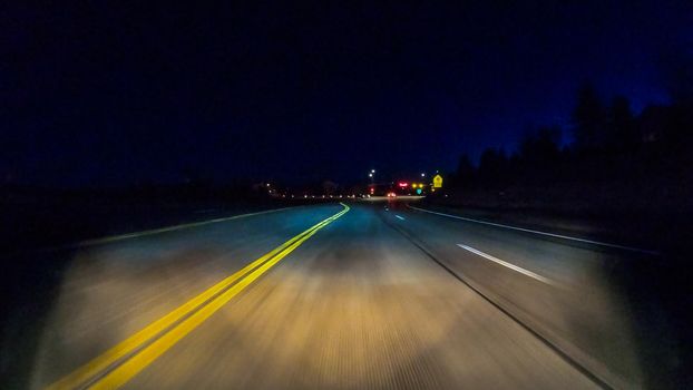 Driving on typical paved roads at night in suburban America.