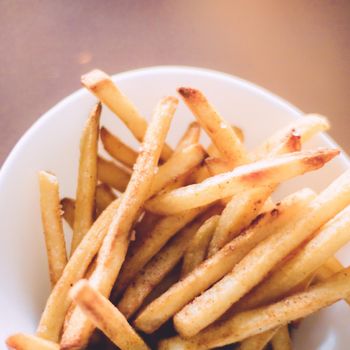 rustic food and homemade cooking styled concept - just cooked french fries served, elegant visuals